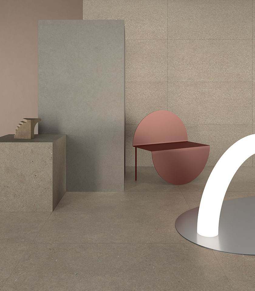 Minimalistisches Interieur mit Steinoptik, neutralen Farbtönen und skulpturalen Möbeln für eine moderne, reduzierte Atmosphäre.