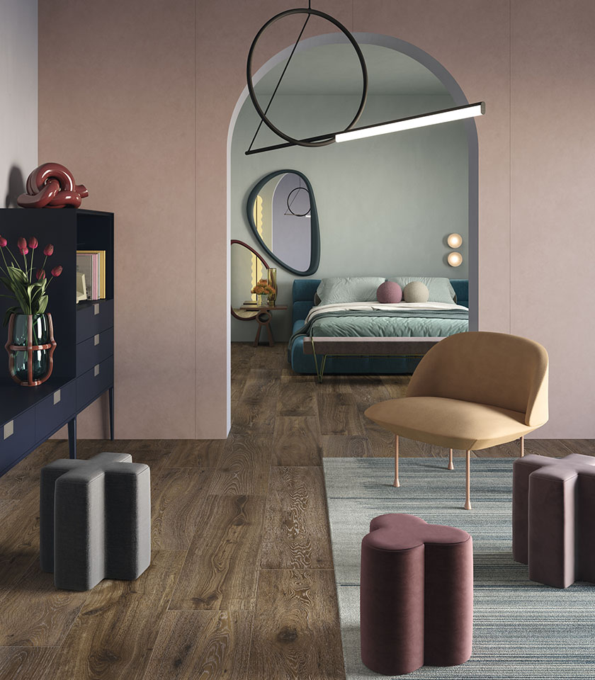 Modernes Schlafzimmer mit Holzoptik, zartrosa Wänden und Möbeln mit weichen Formen.