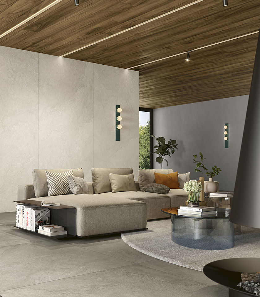 Entdecken Sie Ideen für ein modernes Wohnzimmer mit ausdrucksstarker Materialität und Oberflächen von Lea Ceramiche, die Eleganz, Komfort und Design vereinen.